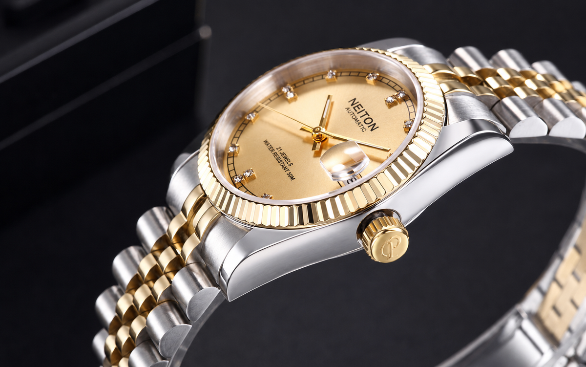 A close-up of a luxury double gold watch